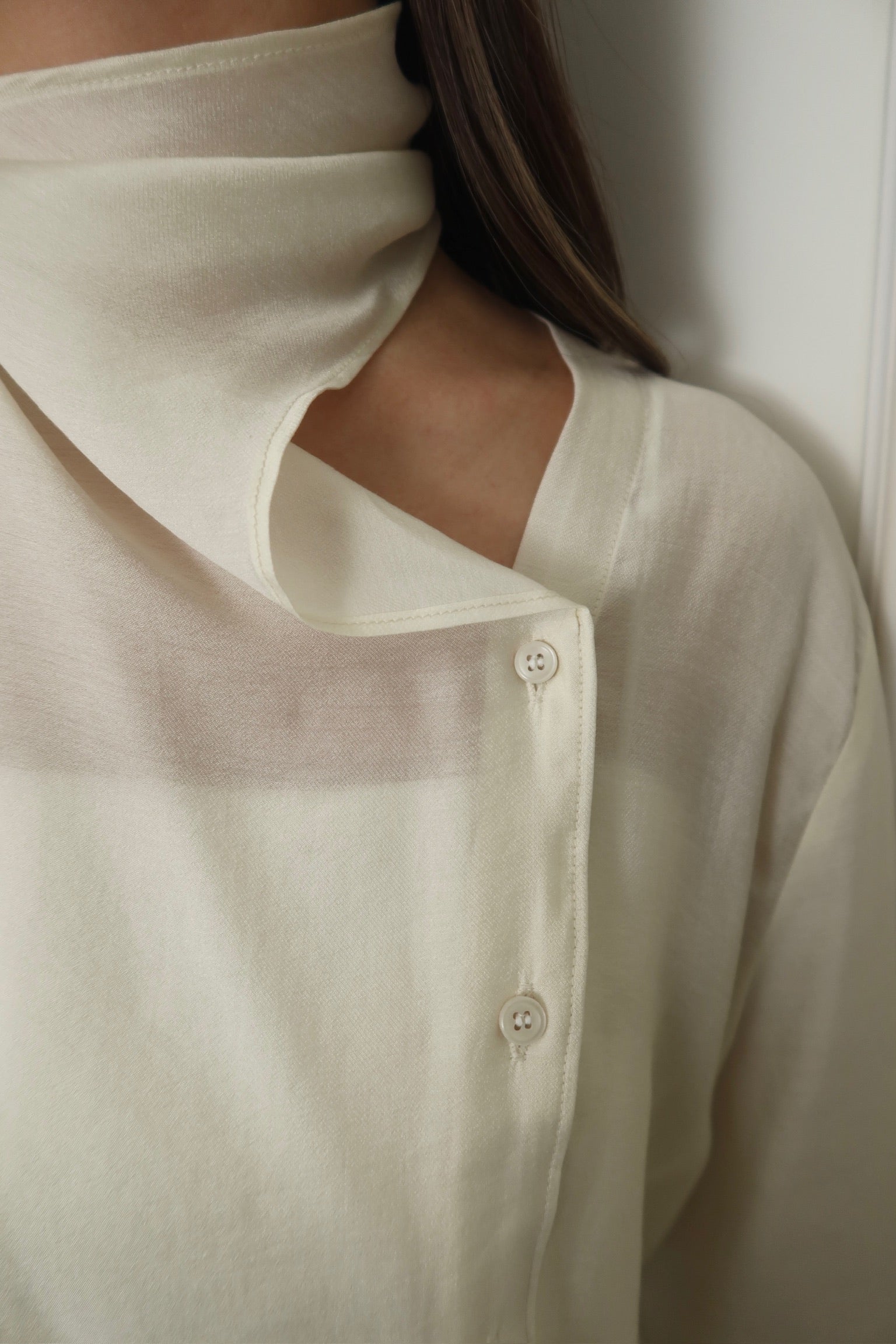 A design of a cream white turtleneck scarf top [T0182]