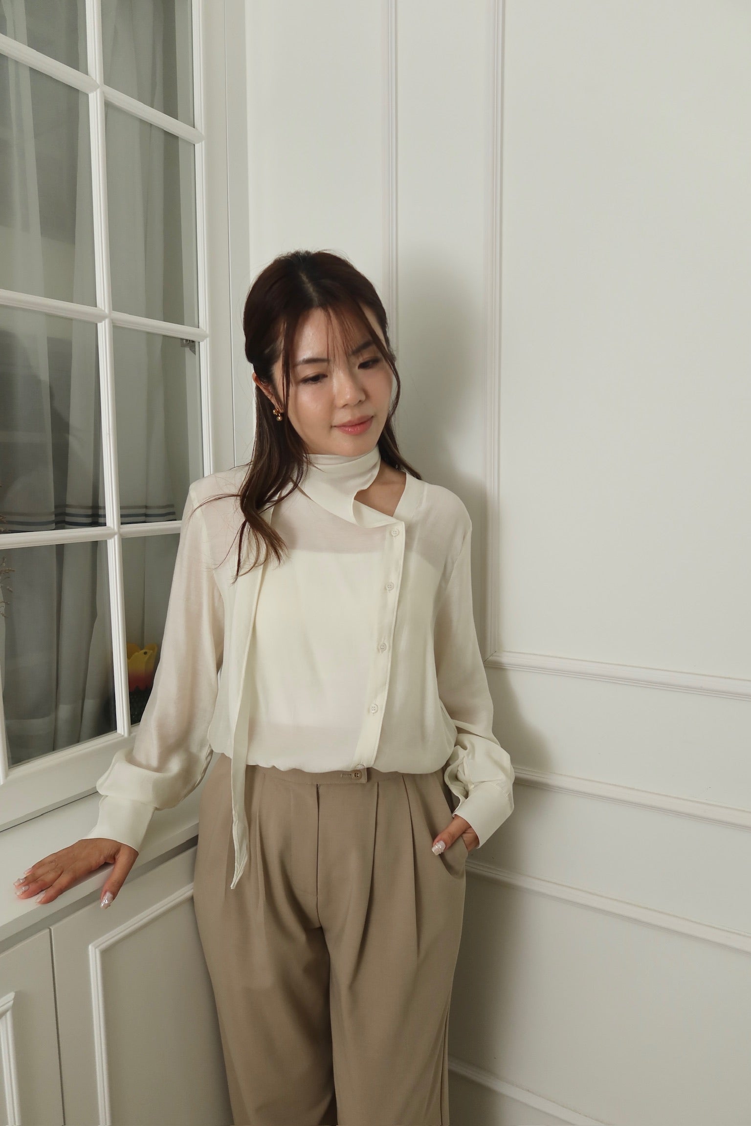 A design of a cream white turtleneck scarf top [T0182]